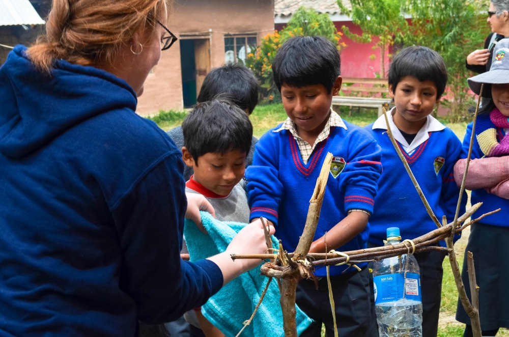 Piscacucho students washing their hands with the Tippy Tap.
